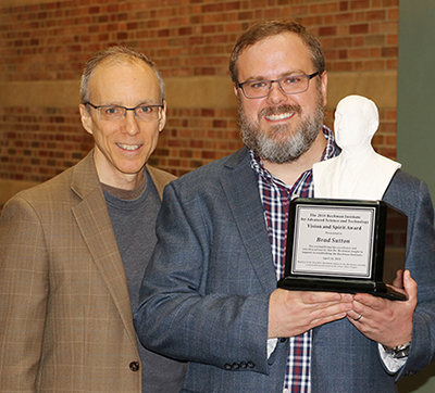 Jeff Moore (left), director of the Beckman Institute, poses with Brad Sutton, a professor of bioengineering and the technical director of the Biomedical Imaging Center at the Beckman Institute, during a reception celebrating Arnold Beckman's birthday and Sutton being awarded the 2018 Beckman Institute for Advanced Science and Technology Vision and Spirit Award.
