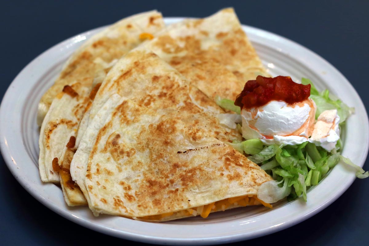 Cheese Quesadilla with salsa, sour cream, and guacamole on the side.