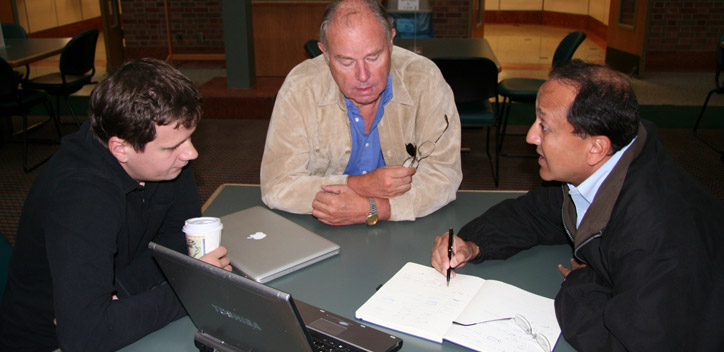 Co-principal investigators (from left), Aleksei Aksimentiev, Jean-Pierre Leburton, and Rashid Bashir discuss plans for the nanopore DNA sequencing project they are leading.