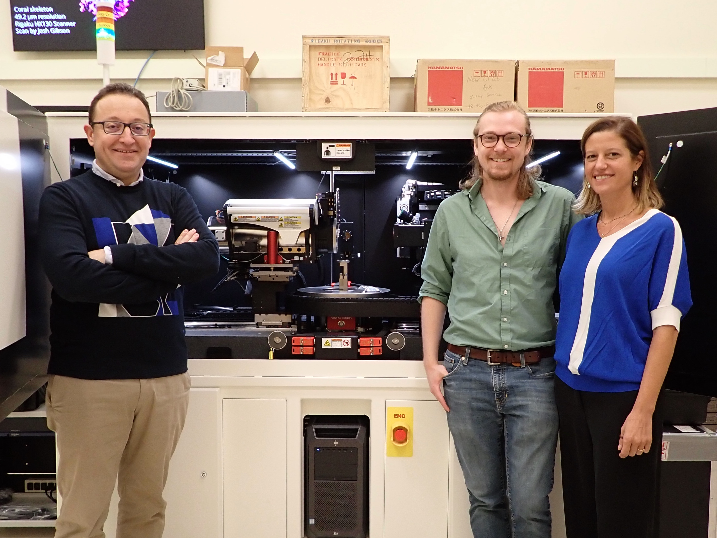 Francesco Panerai (left), Cutler Phillippe (center) and Laura Villafañe Roca in front of the micro-CT scanner at the Beckman Institute.