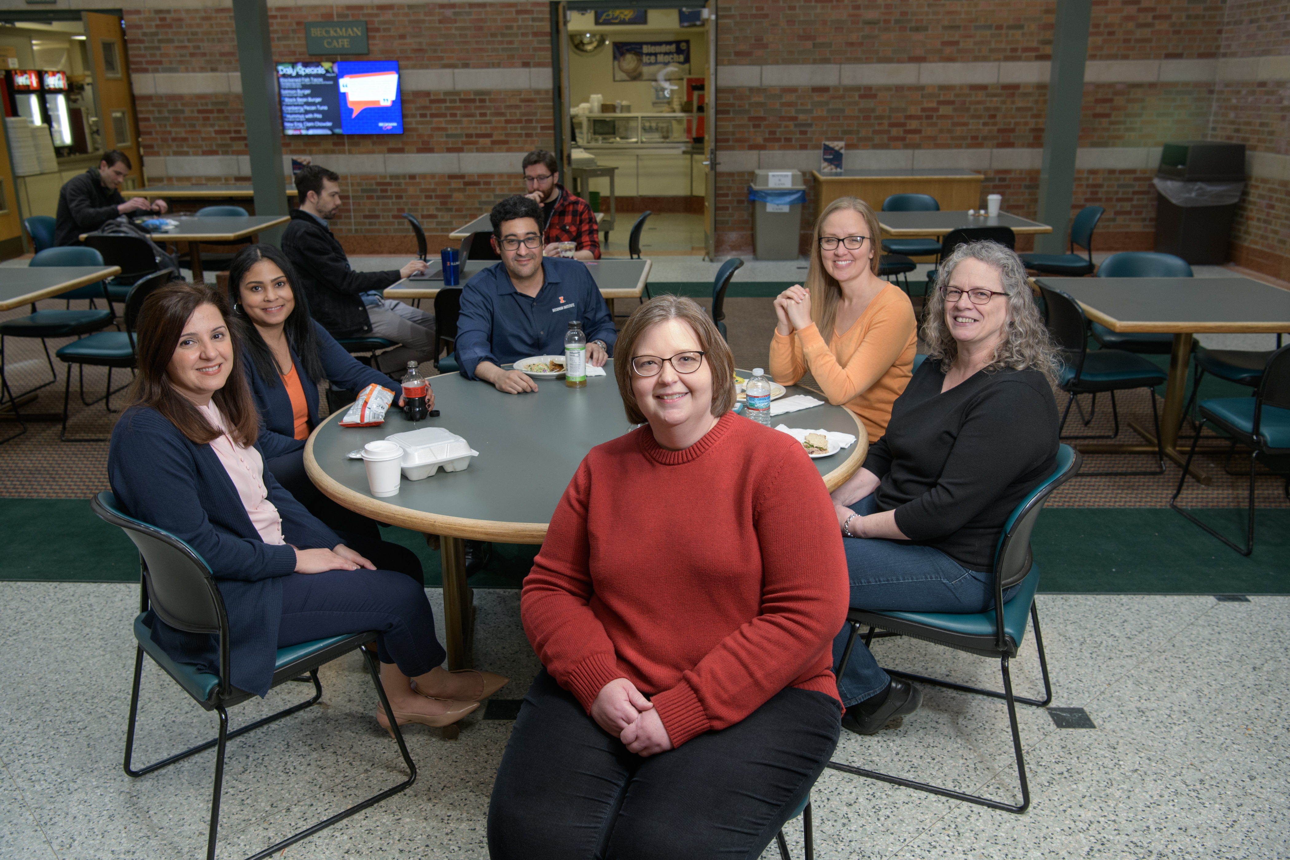 The members of the Beckman Business Office share a meal in the Beckman Café.