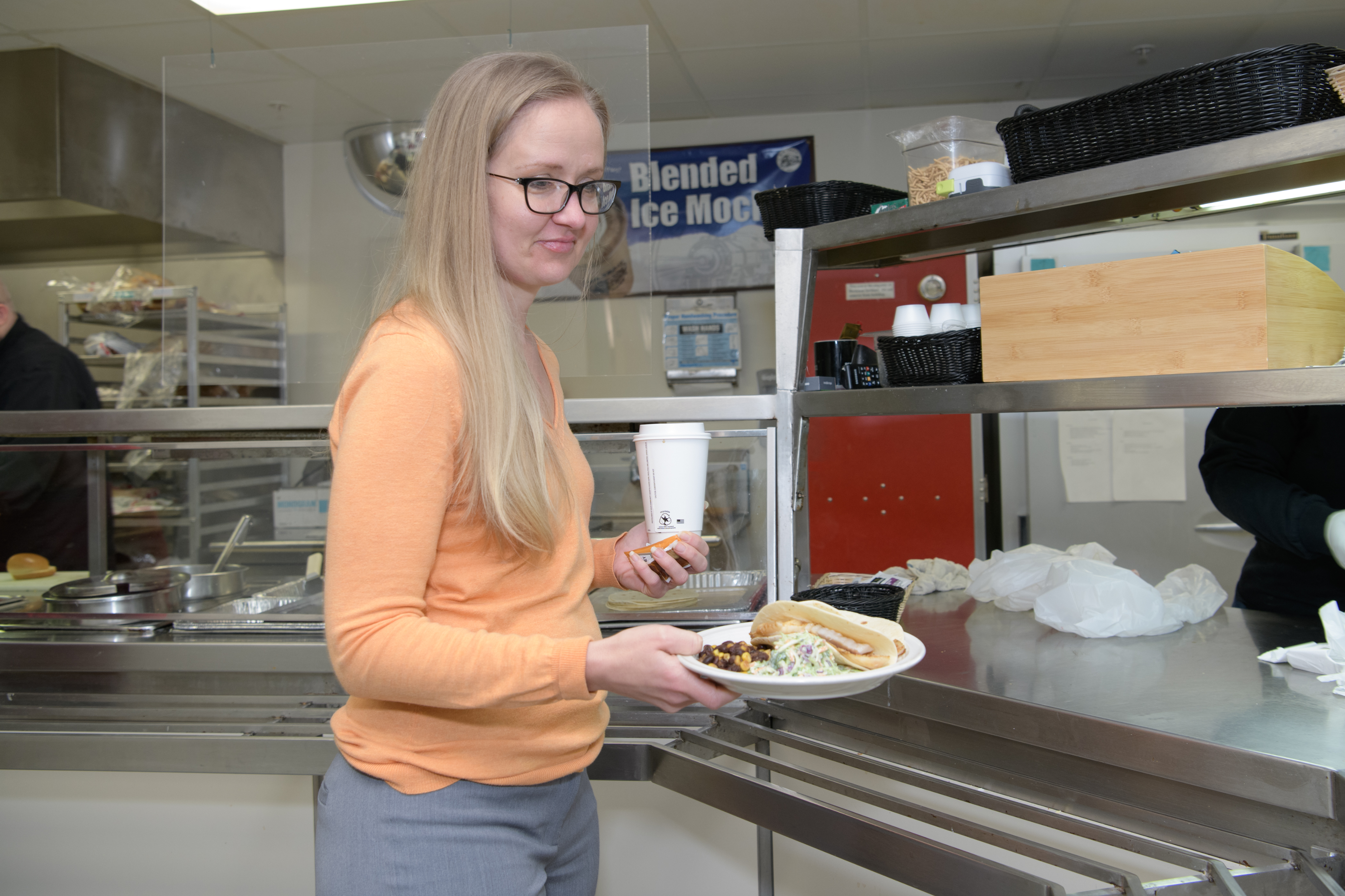 Woman grabs a meal at the Beckman Café