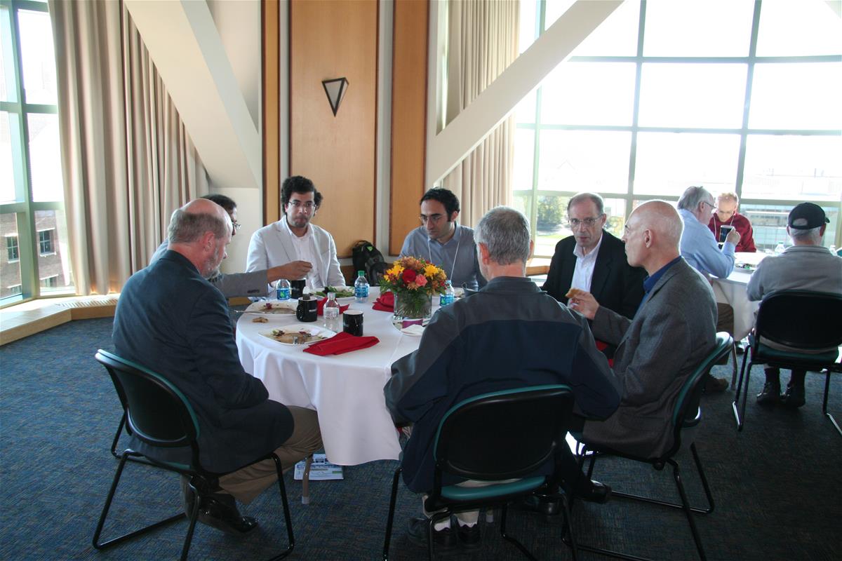 A research group talks over lunch catered in Beckman's fifth-floor tower room.