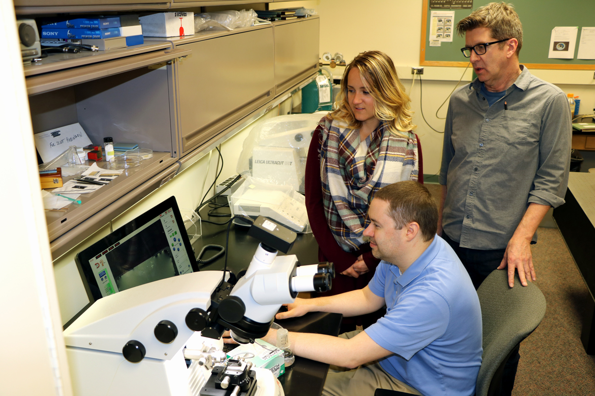 Members of Information Technology Services are in the Microscopy Suite assisting with a computer issue.