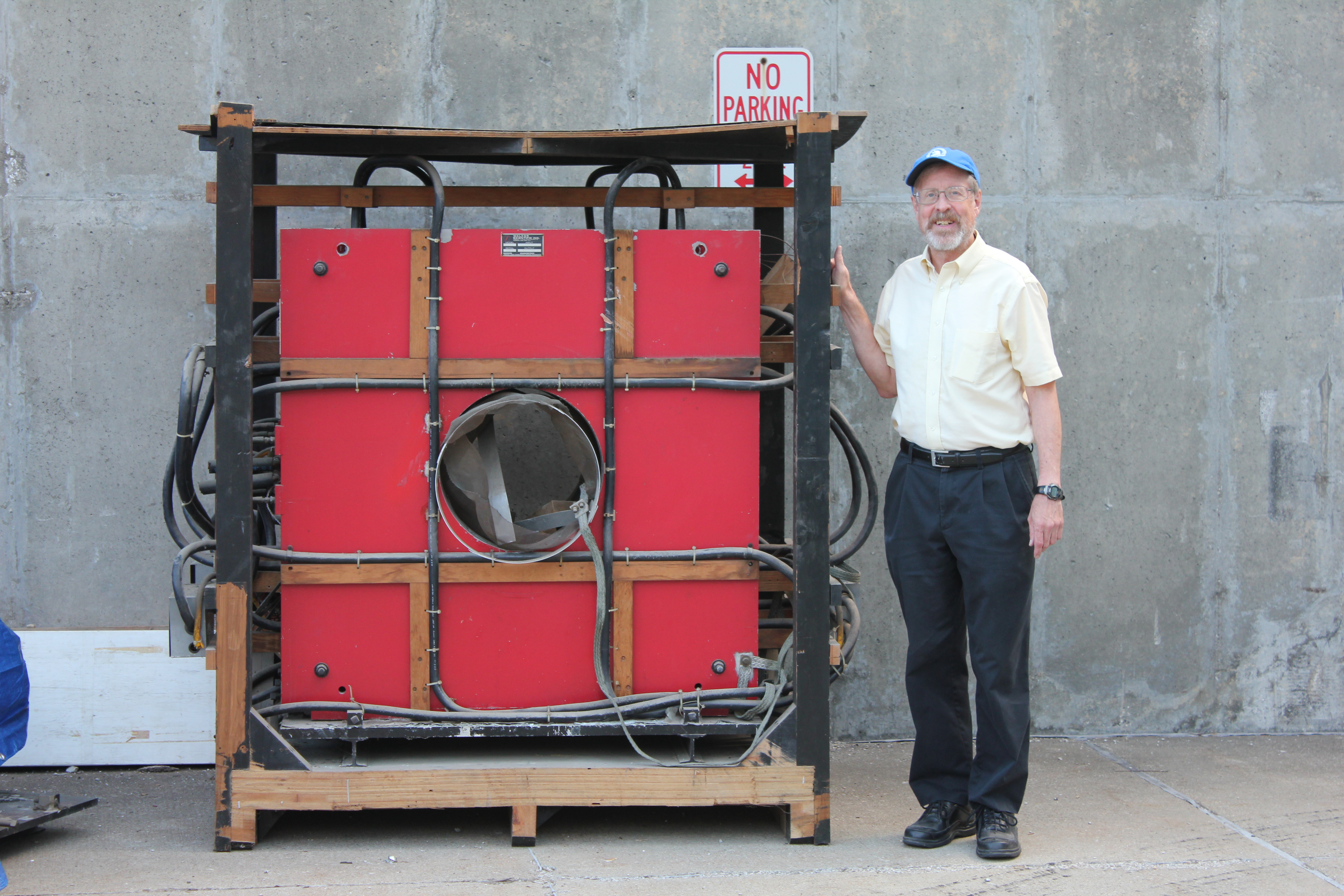 Earle Heffley poses beside Big Red on the day it was moved into the Beckman Institute.