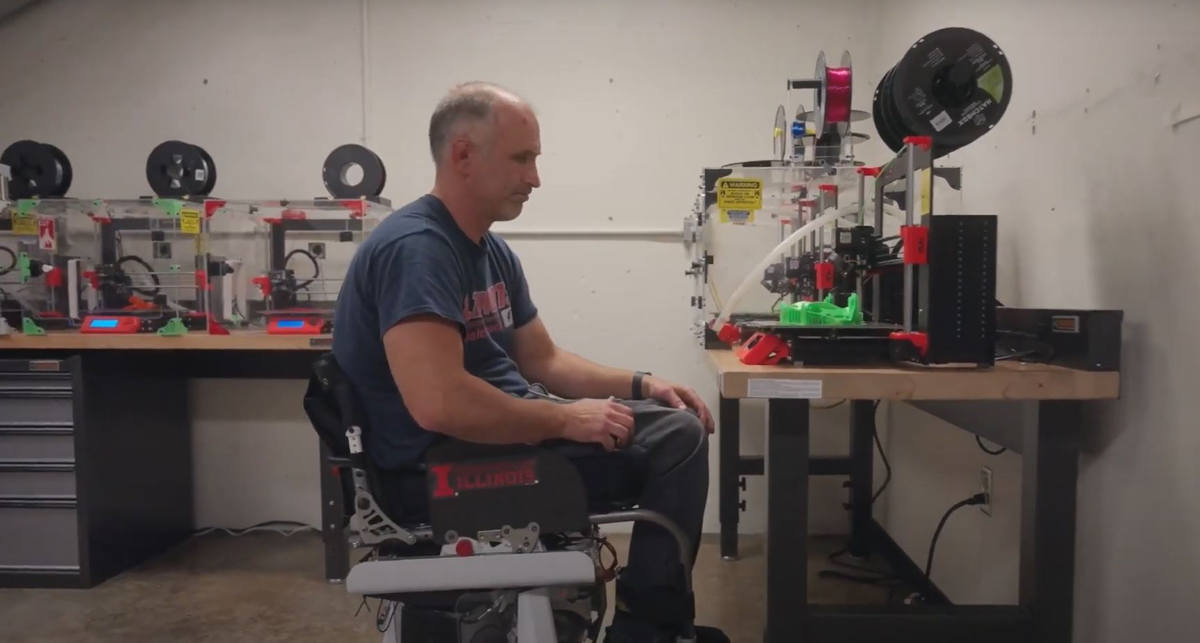 Adam Bleakney navigates a room using a hands-free wheelchair.