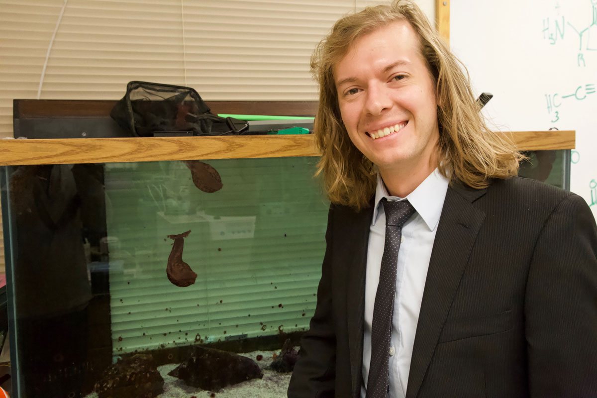 Kevin Clark in his lab with sea slugs