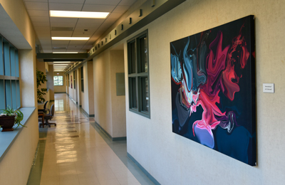 A photo of the painting called Amorphous shown hanging in the northeast hallway of the second floor.