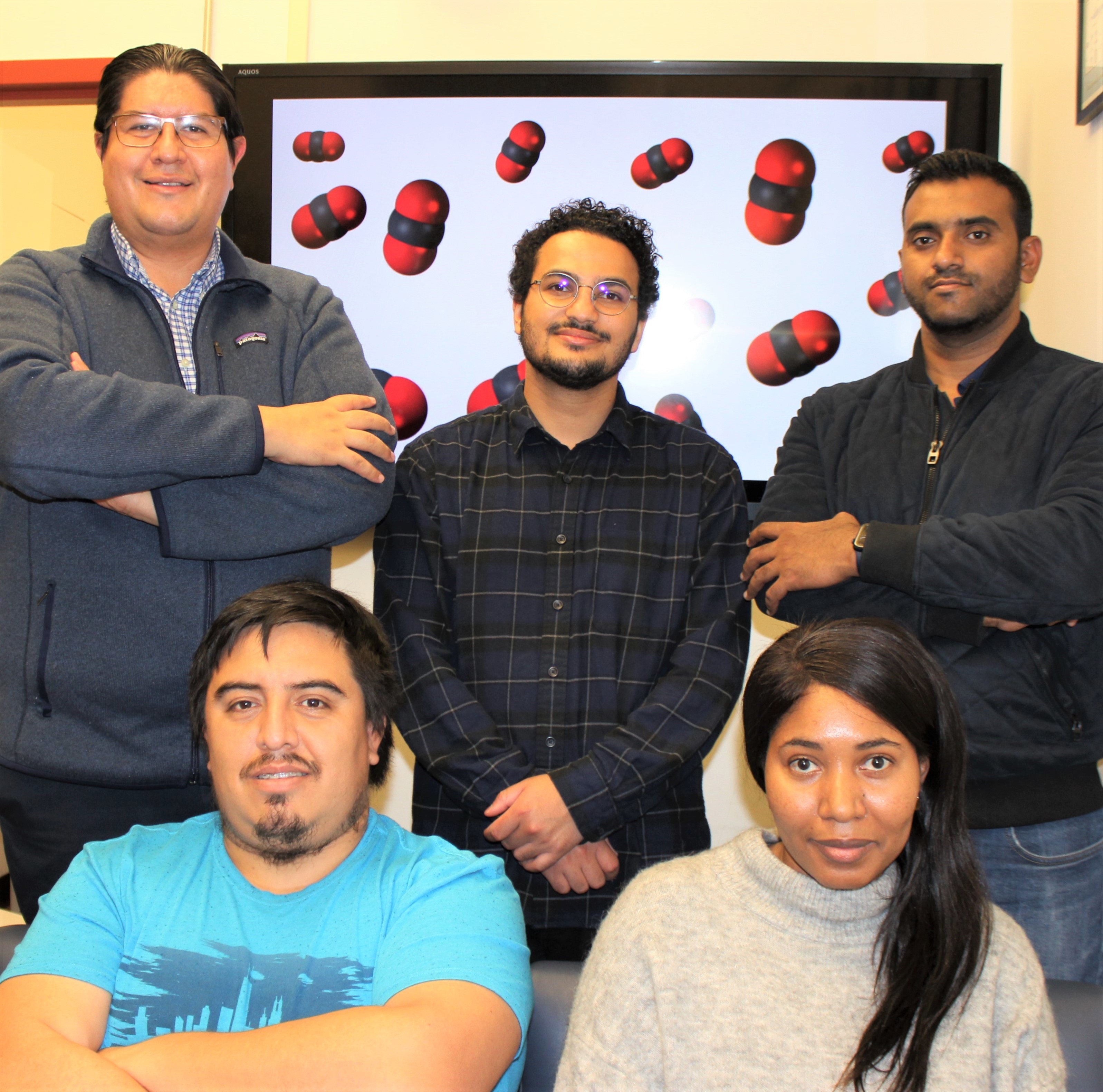 Members of the Rodríguez-López lab working on the carbon capture project. From back row, left: Joaquín Rodríguez-López, Abdur-Rahman Siddiqui, Md. Sazzad Hossein. From front row, left: Adolfo Barros Romo, Jeanne N’Diaye.