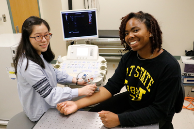 Yang Zhu, a Ph.D. student in bioengineering, (left), and Janee Phillips, a junior in bioengineering at North Carolina A&amp;T University