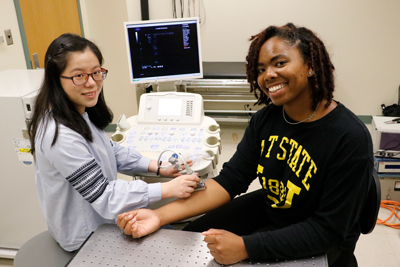  Yang Zhu, a Ph.D. student in bioengineering, (left), and Janee Phillips, a junior in bioengineering at North Carolina A&T University