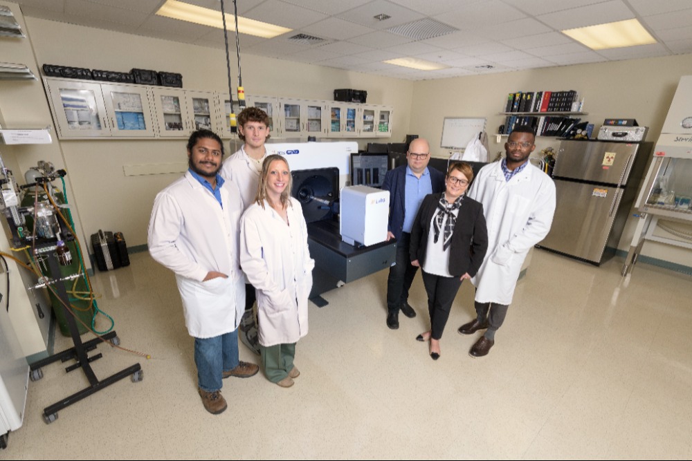 Research team with Beckman's new PET/CT scanner.