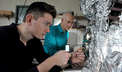 Adrian Radocea and Joe Lyding examine a sample nanoribbon.