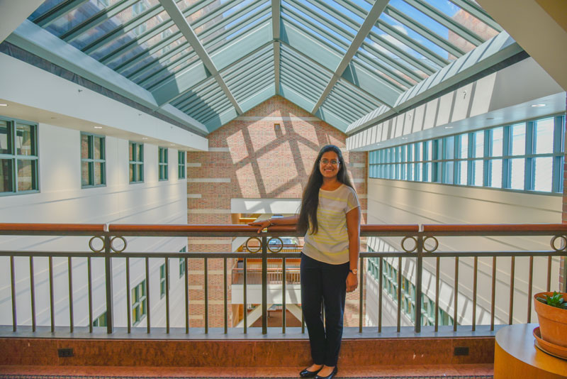 Standing on a bridge linking the north and south sides of the Beckman Institute, Shachi Mittal embodies her own desire to be a bridge between disciplines in her research.