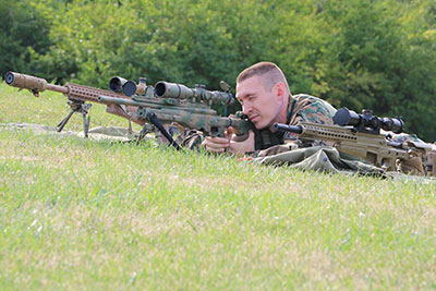 Officer Grant Briggs, of the U of I Police Department and a member of the METRO sniper unit, fires a round at 100 yards from the target.