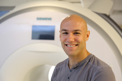 A photo of Beckman Institute Postdoctoral Fellow Ben Zimmerman in the MRI suite at the Beckman Institute.