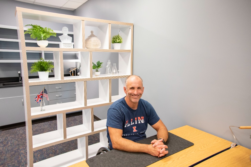 Adam Bleakney at his workspace in the (dis)Ability Design Studio