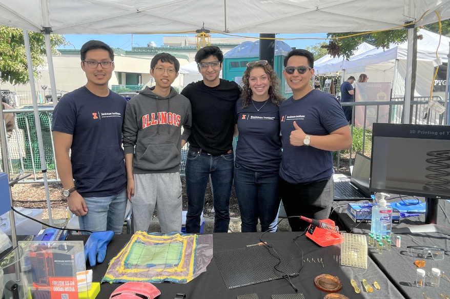 A group of grad students pose at an outreach event