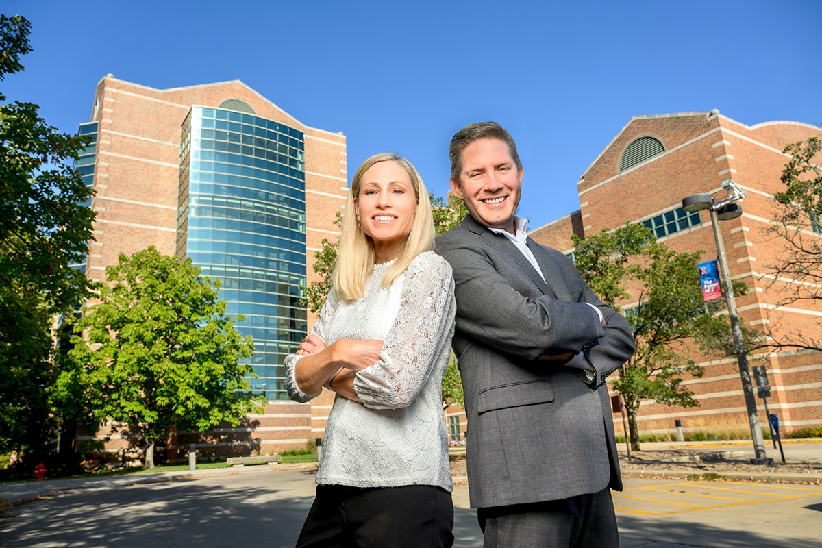 Marni and Steve Boppart Marni and Steve Boppart pose back-to-back in front of the Beckman Institute.