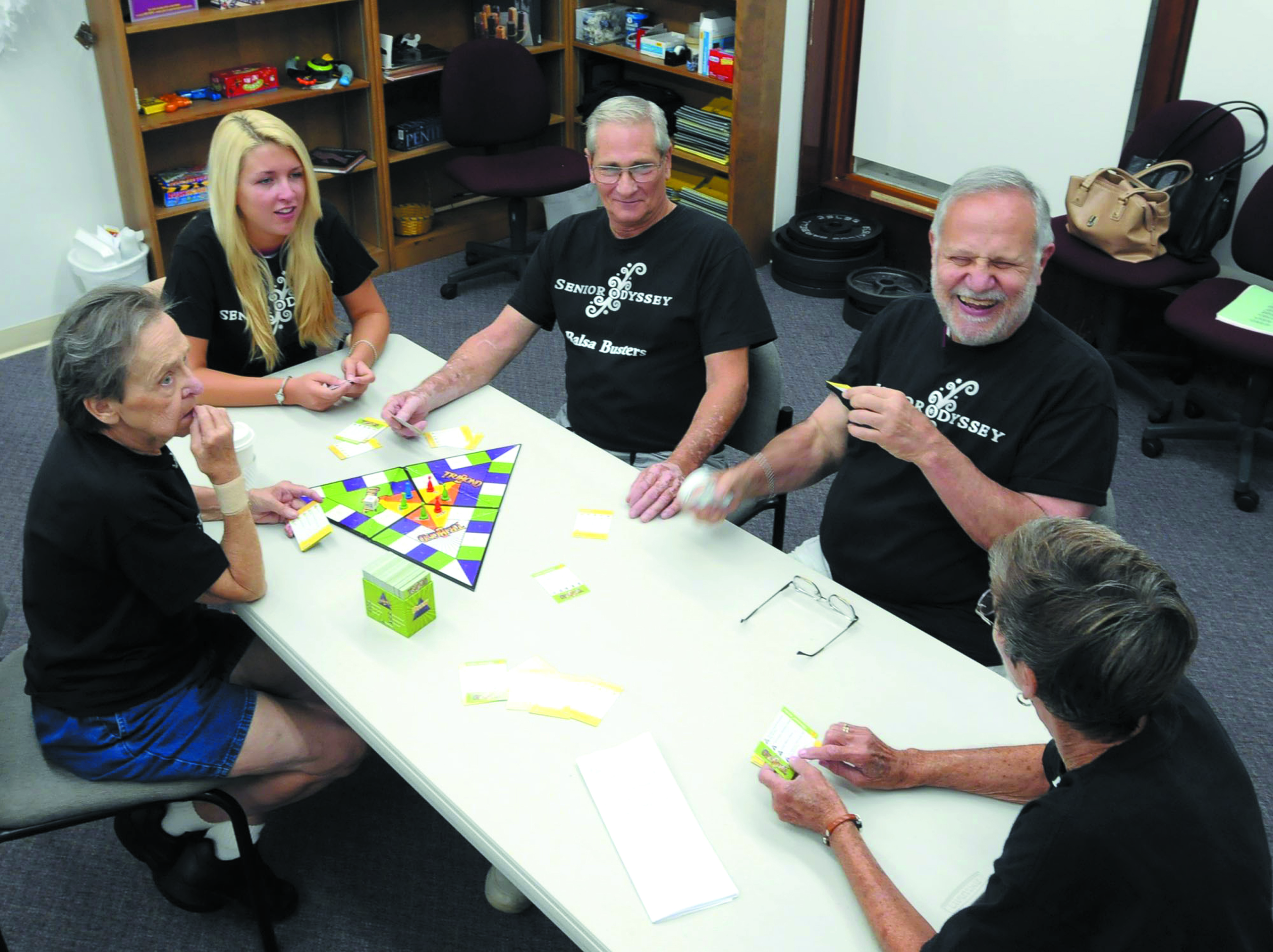 A group of adults sits around the table at the Beckman Institute