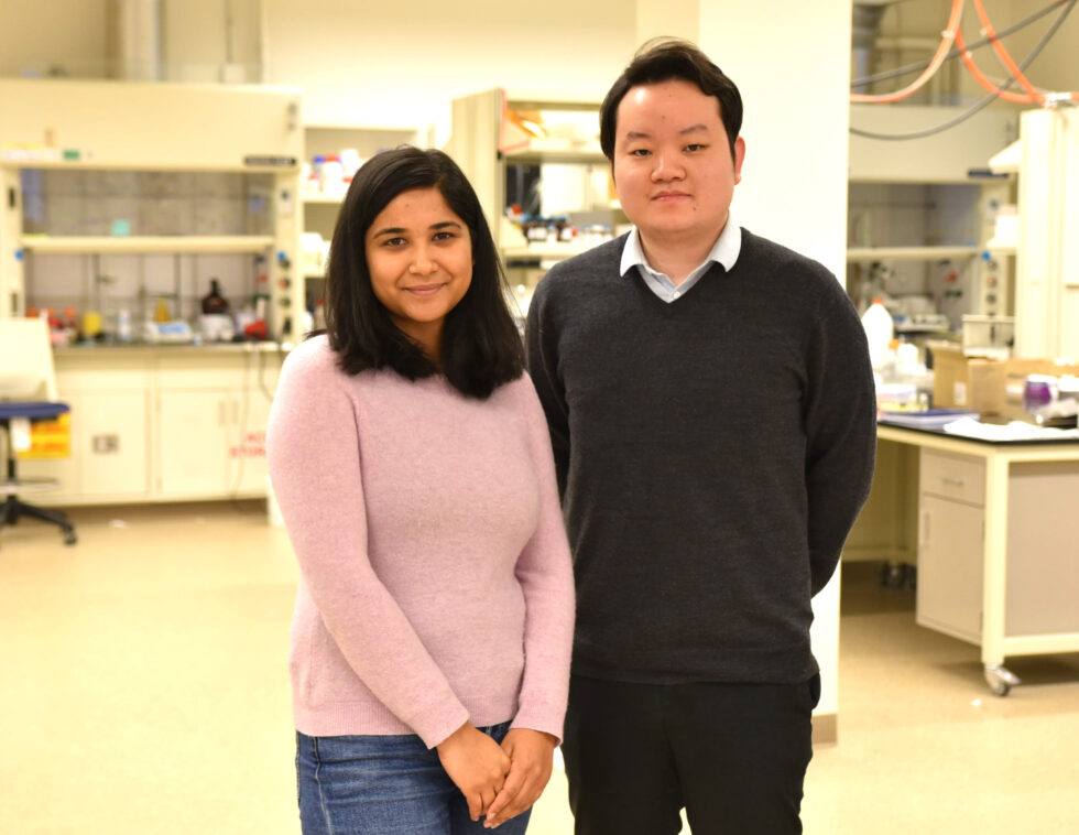 Hua Wang photographed in lab with Rimsha Bhatta